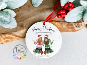 personalised Christmas Bauble showing 2 sisters holding drinks