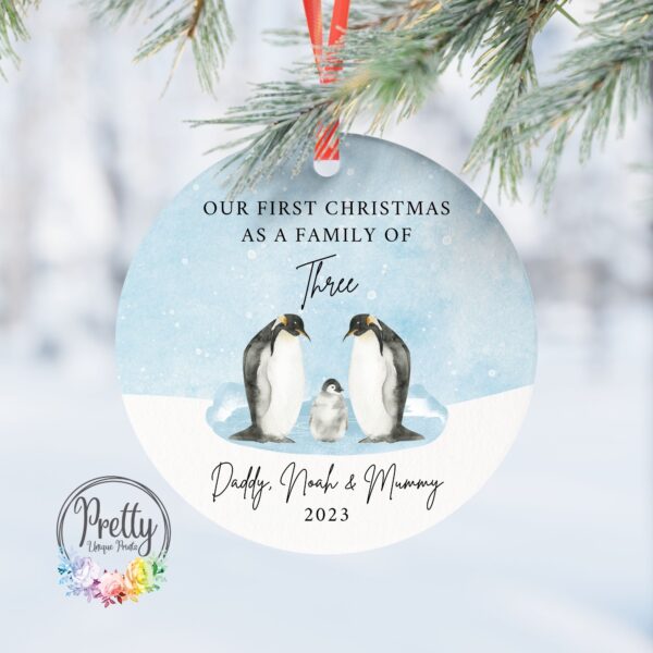 Christmas Bauble with 3 penguins & quote saying our first Christmas as a family of three