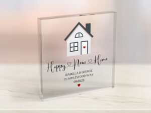 Personalised Acrylic Block House warming gift. Design with small house on and quote saying *Happy New Home* with homeowners name, address and date they moved.