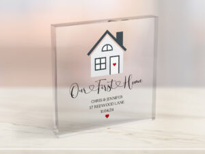 Personalised Acrylic Block House warming gift. Design with small house on and quote saying *Our First Home* with homeowners name, address and date they moved.